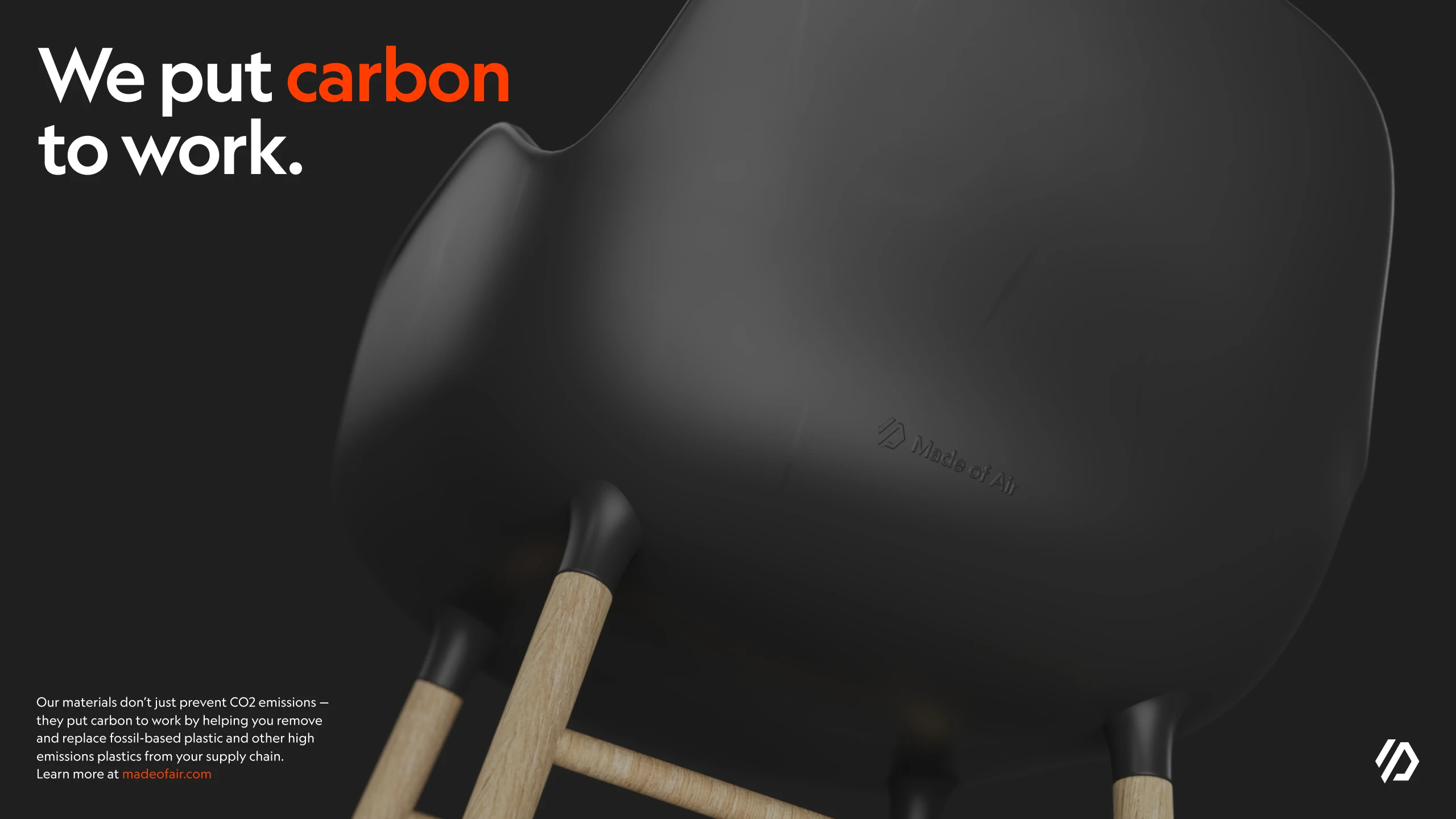 Advertisement reading We put carbon to work, beside the rendered black chair shell on wooden legs
