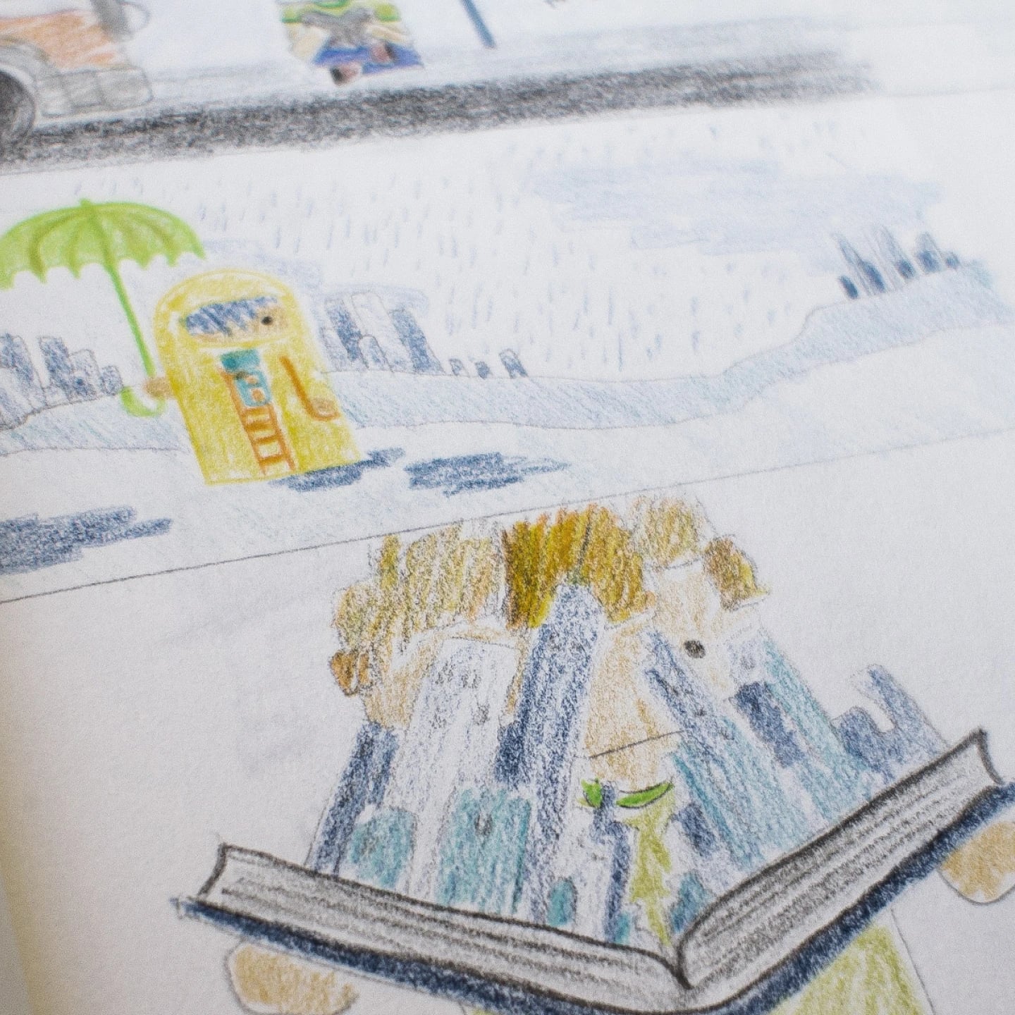 Coloured-pencil sketchbook page placing squircle characters in scenes: a figure under a green umbrella in the rain, and a city skyline rising from an open book